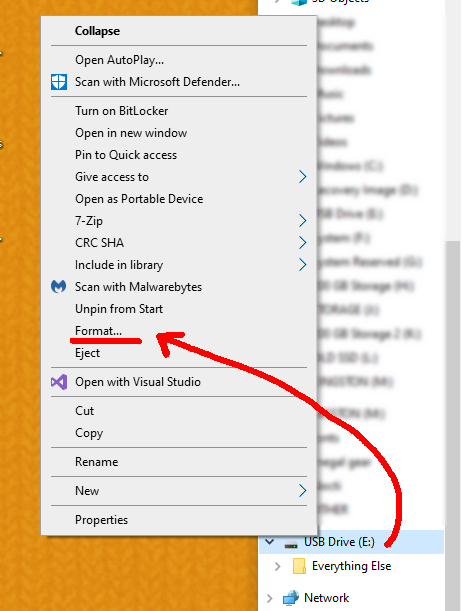 A red arrow is pointing from the USB Drive that represents the Micro SD card to the menu that shows up when the drive is right clicked. The option Format... is underlined in red